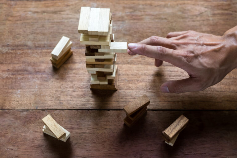 planning-risk-strategy-business-businessman-engineer-gambling-placing-wooden-block-tower